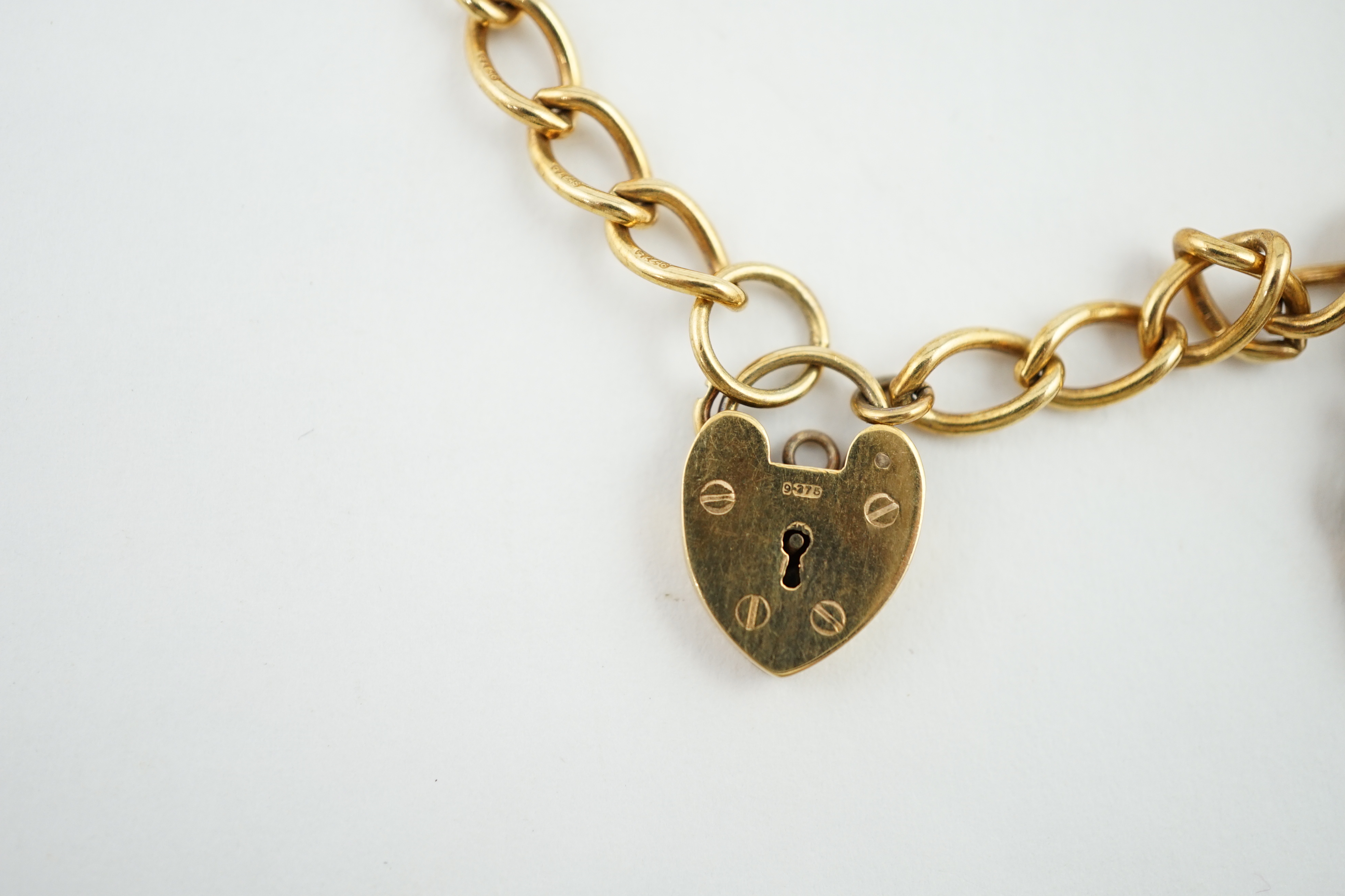 A 1960's 9ct gold oval link charm bracelet